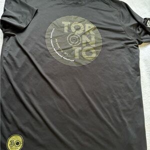New Balance Black Tee with Gold Graphic